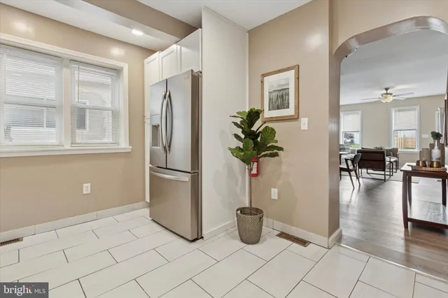 a view of a livingroom with furniture and a potted plant