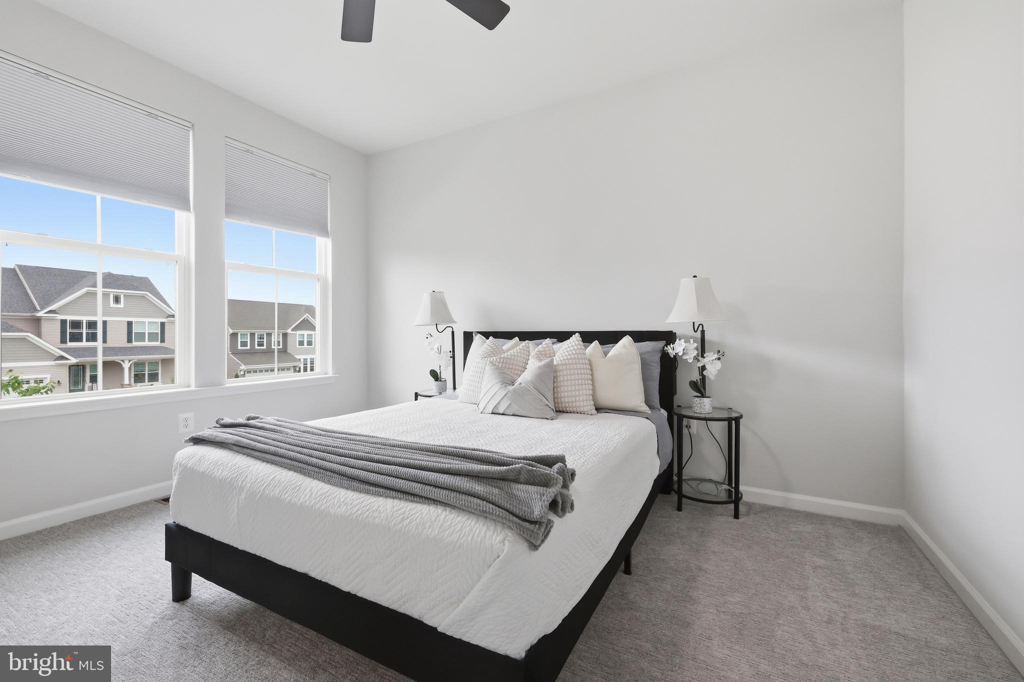 5707 Hawk Ridge Road Frederick, MD 21704 - Photo 57 of 109 a bed sitting in a bedroom next to a window