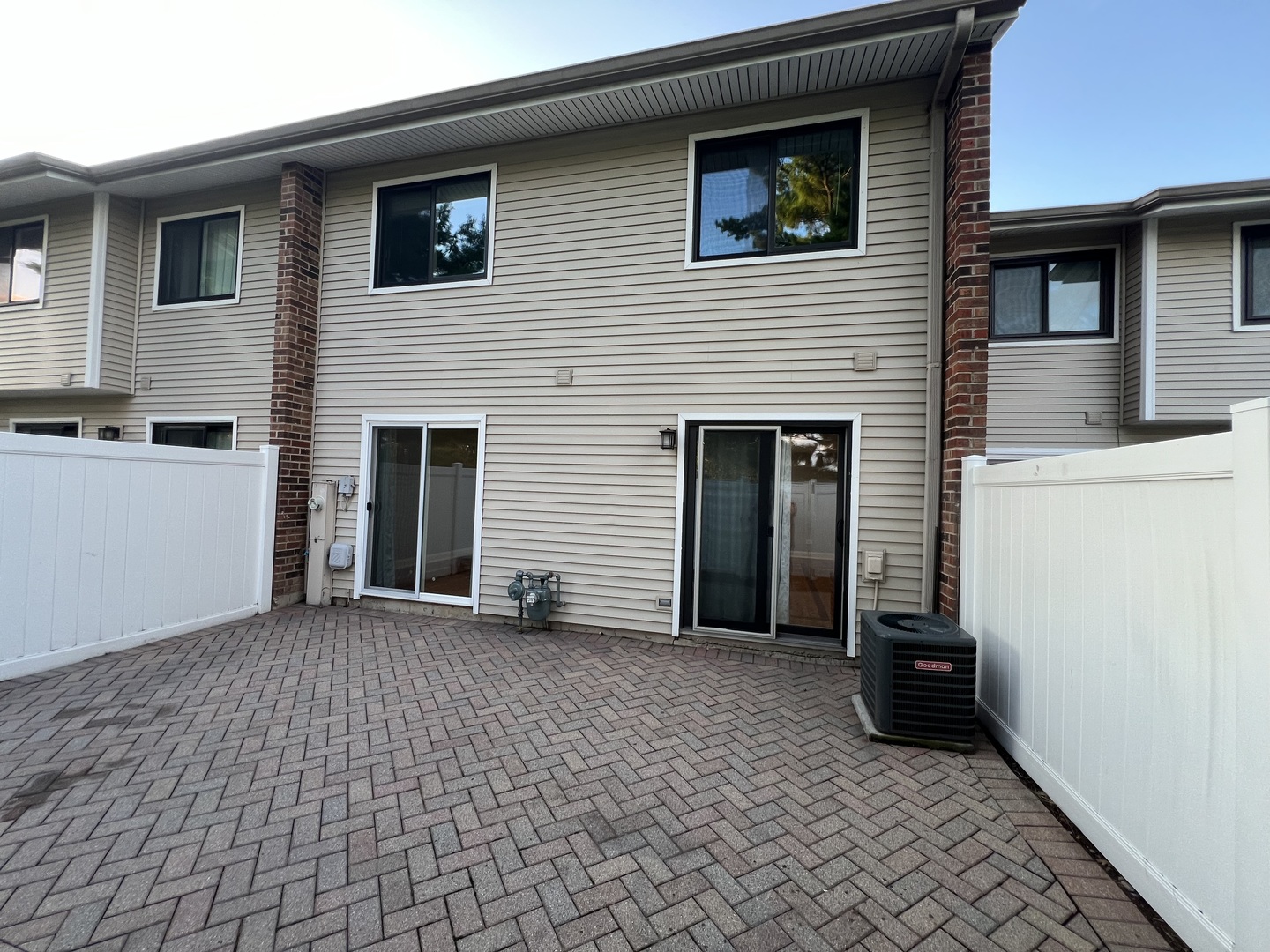 1067 Cascade Drive Aurora, IL 60506 - Photo 19 of 20 a view of a house with a barbeque and wooden fence