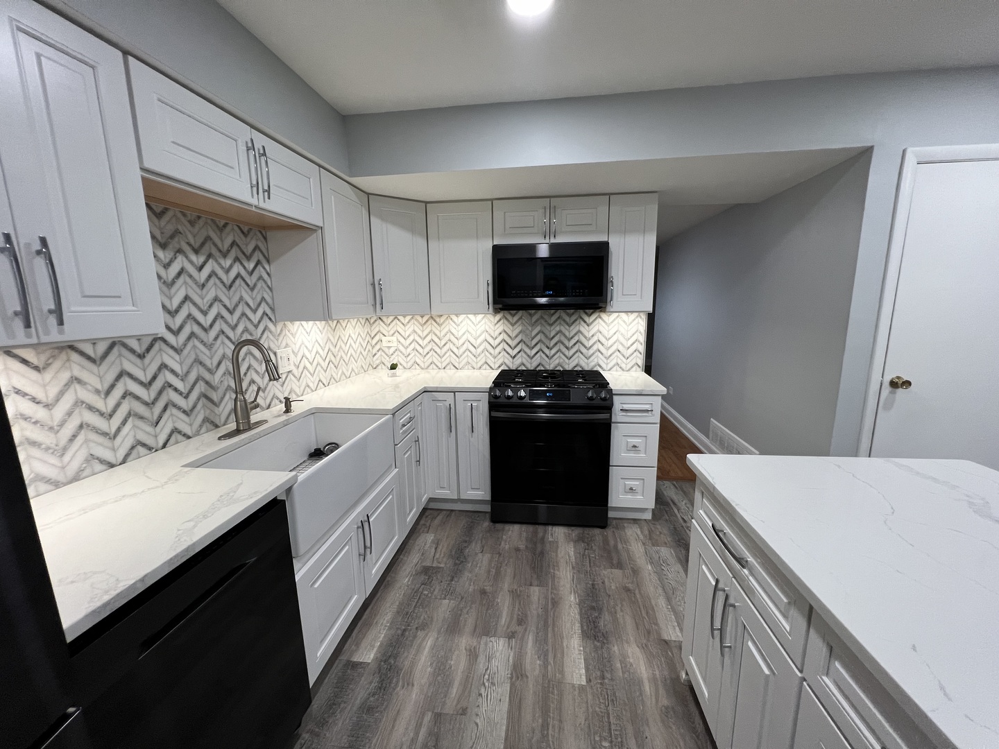 1067 Cascade Drive Aurora, IL 60506 - Photo 6 of 20 a kitchen with a stove and a sink