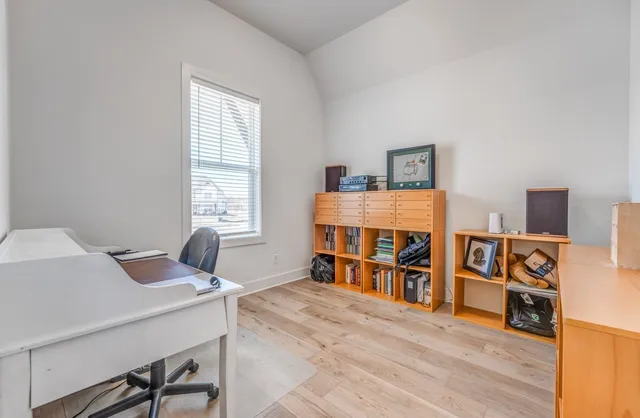 a view of a workspace with furniture