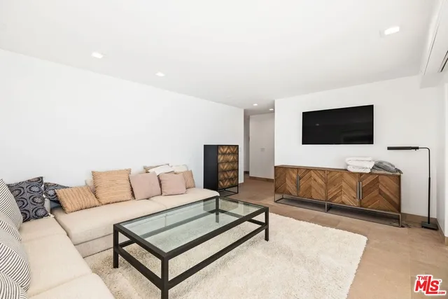 a bedroom with a bed and a painting