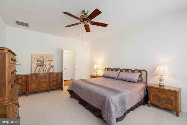 a bedroom with a bed and dresser