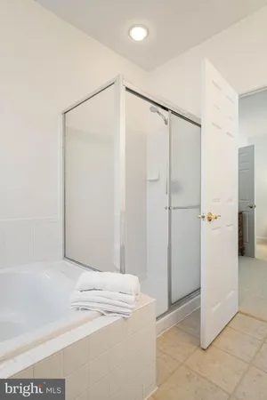 a view of a bathroom with a shower and a sink