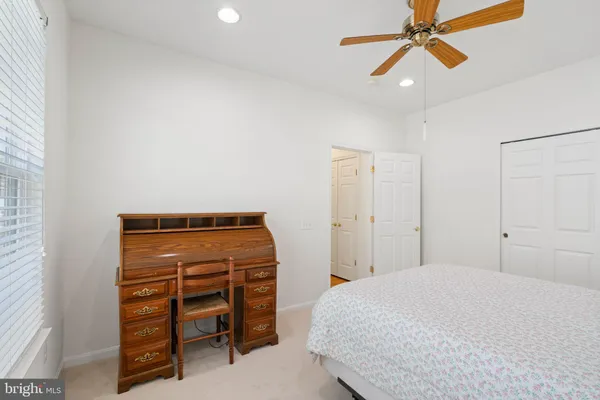 a bedroom with a bed and cabinets