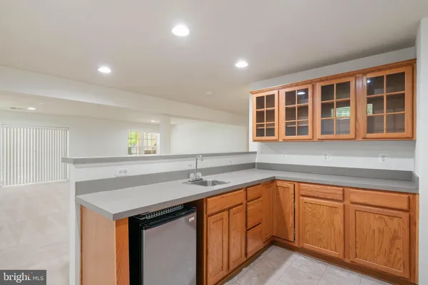 a kitchen with a sink and cabinets