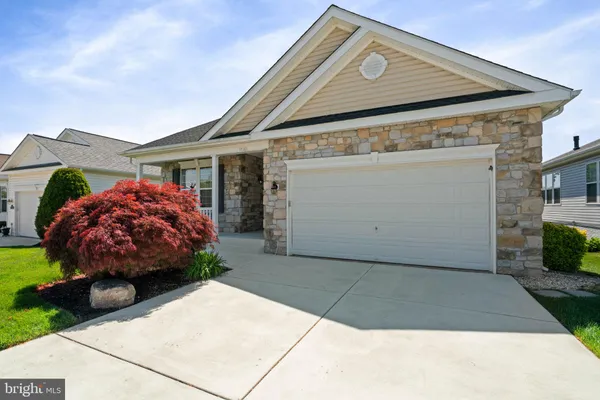 a front view of a house with a garage