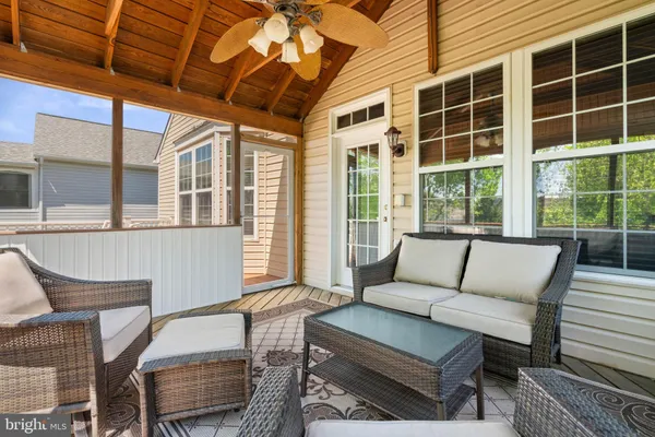 a view of a chair and table on the deck