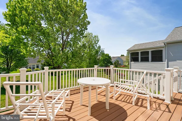 a view of balcony with furniture and garden