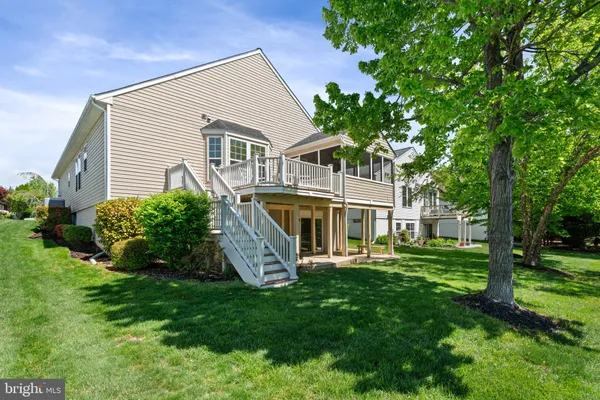 a view of a house with backyard of the house