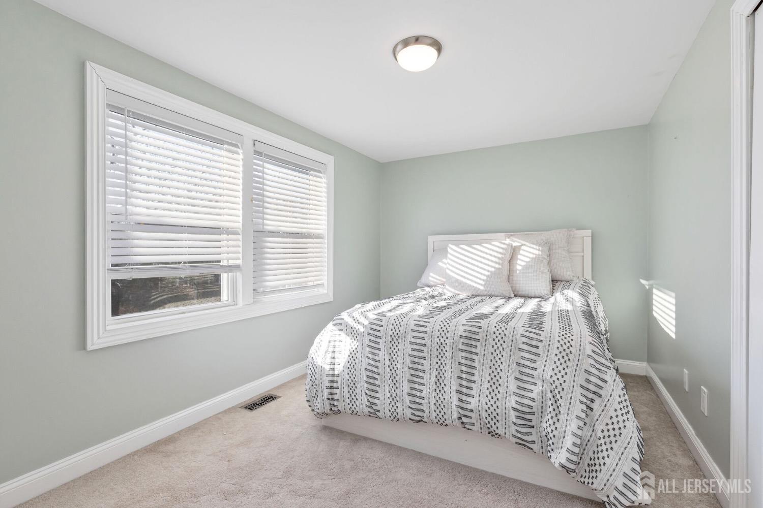 4 Indiana Road Somerset, NJ 08873 - Photo 18 of 31 a bedroom with a bed and a window