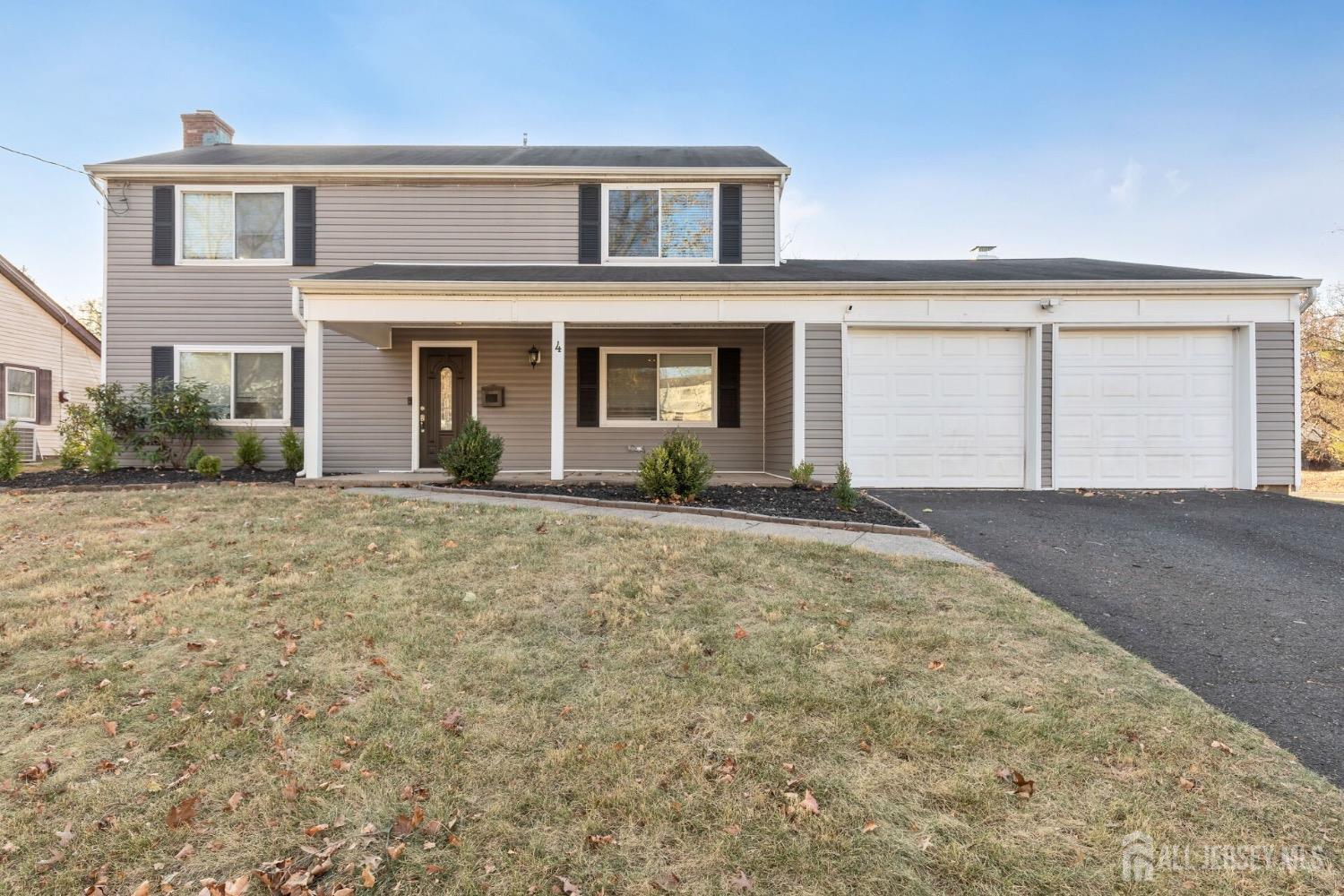 4 Indiana Road Somerset, NJ 08873 - Photo 2 of 31 a front view of a house with a yard