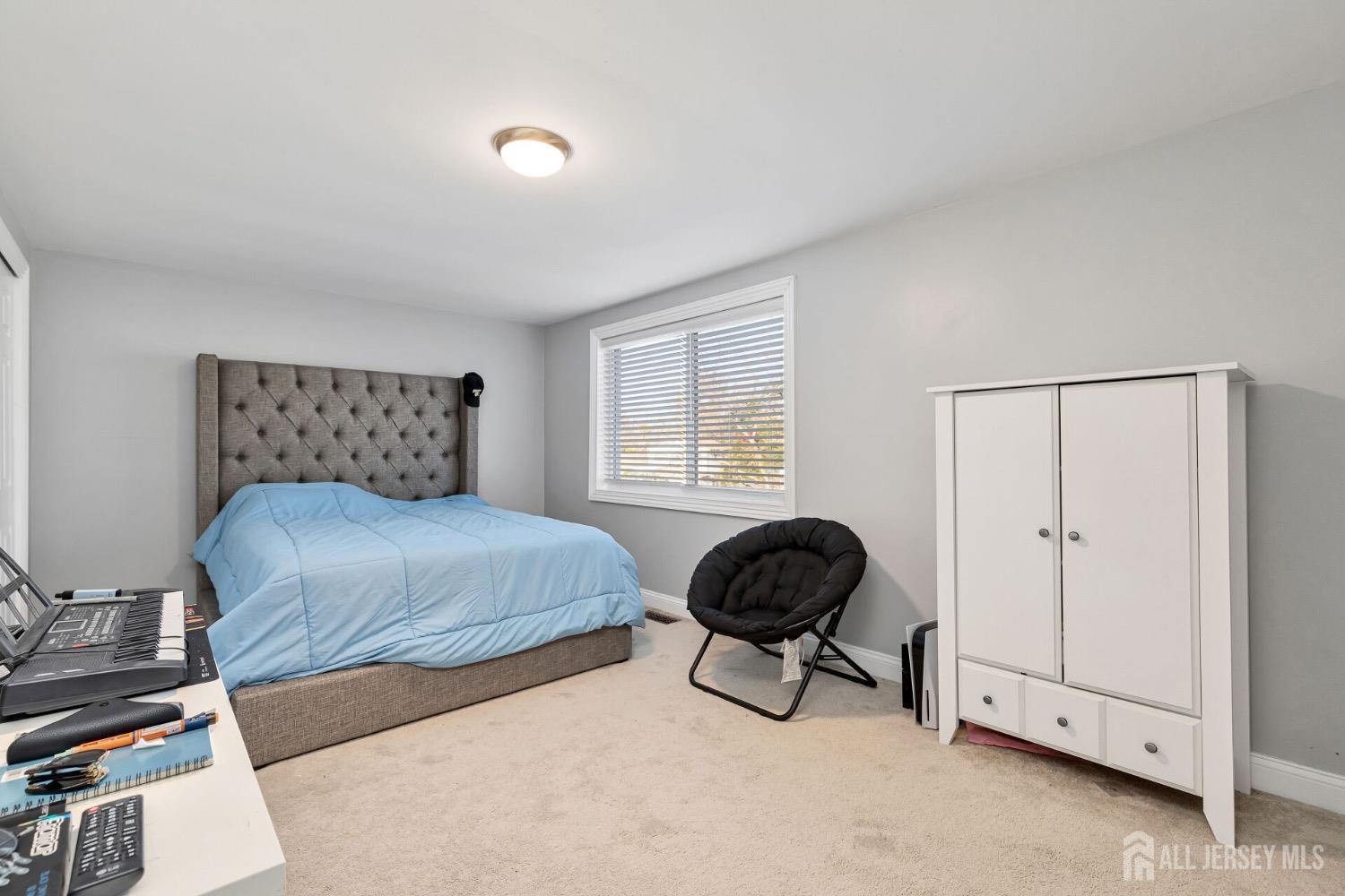 4 Indiana Road Somerset, NJ 08873 - Photo 22 of 31 a bedroom with a bed and a window