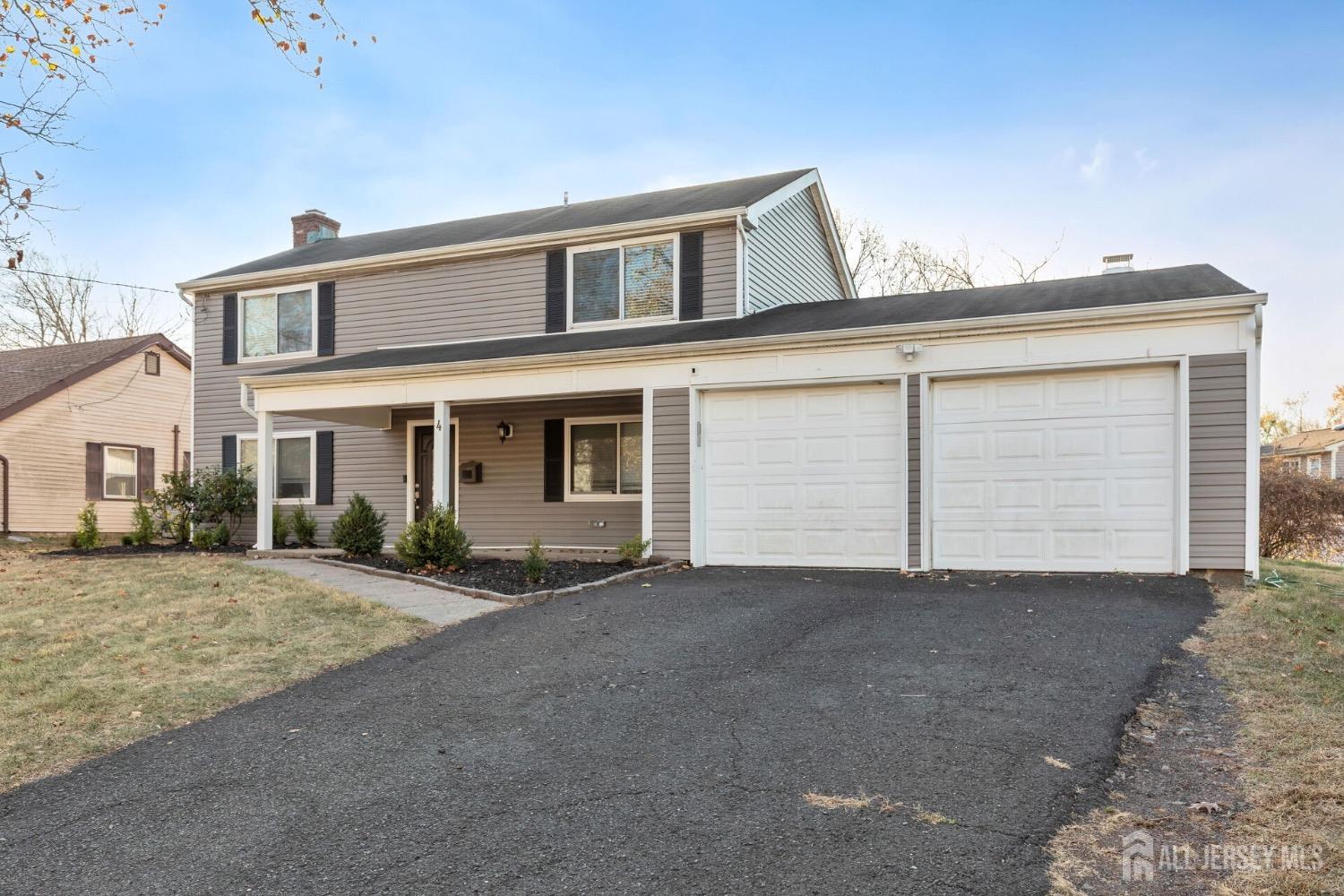 4 Indiana Road Somerset, NJ 08873 - Photo 25 of 31 a front view of a house with a road
