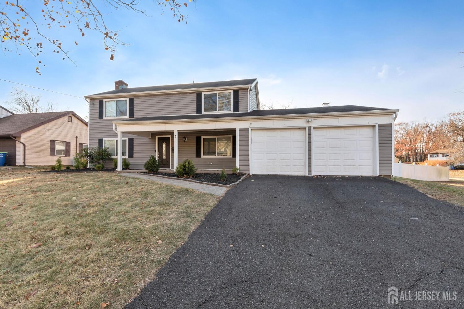 4 Indiana Road Somerset, NJ 08873 - Photo 26 of 31 a front view of a house with a yard