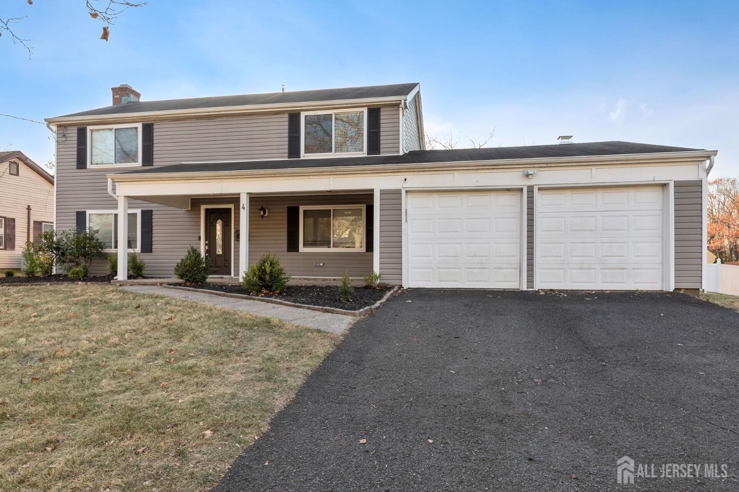 4 Indiana Road Somerset, NJ 08873 - Photo 27 of 31 a front view of a house with a yard and garage