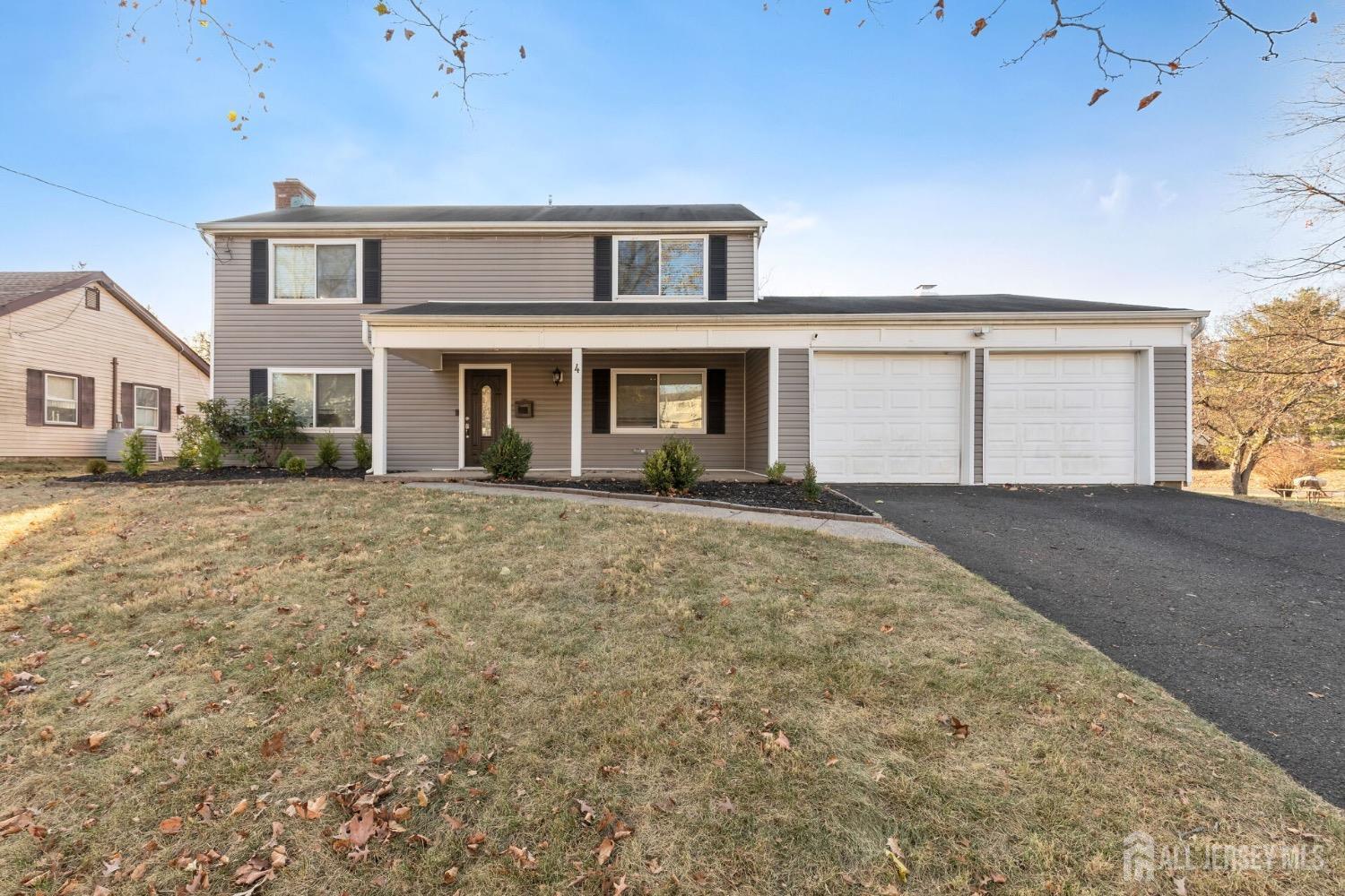 4 Indiana Road Somerset, NJ 08873 - Photo 28 of 31 a front view of a house with a yard