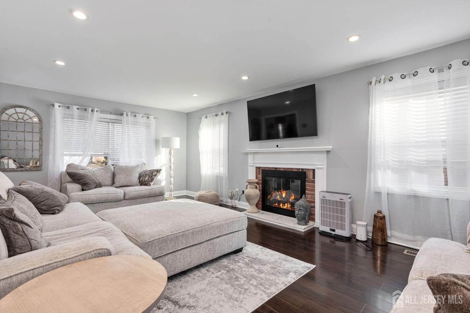 4 Indiana Road Somerset, NJ 08873 - Photo 5 of 31 a living room with furniture fireplace and flat screen tv