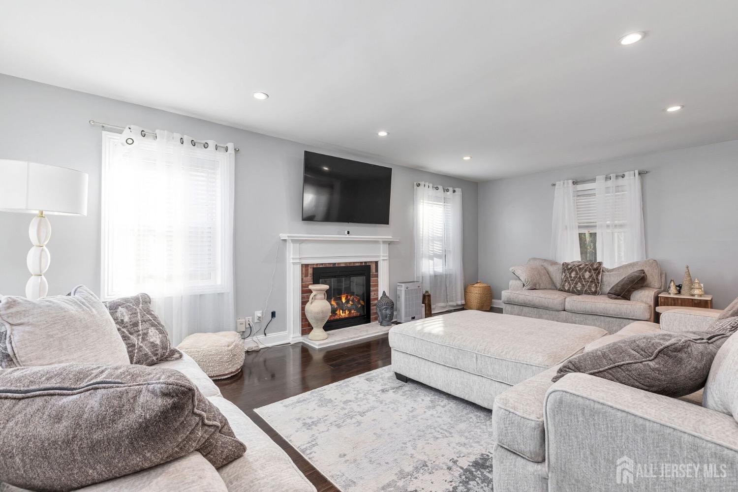 4 Indiana Road Somerset, NJ 08873 - Photo 6 of 31 a living room with furniture and a fireplace