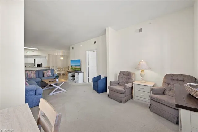 a living room with furniture and gym equipment