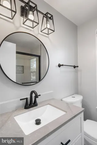 a bathroom with a sink and mirror