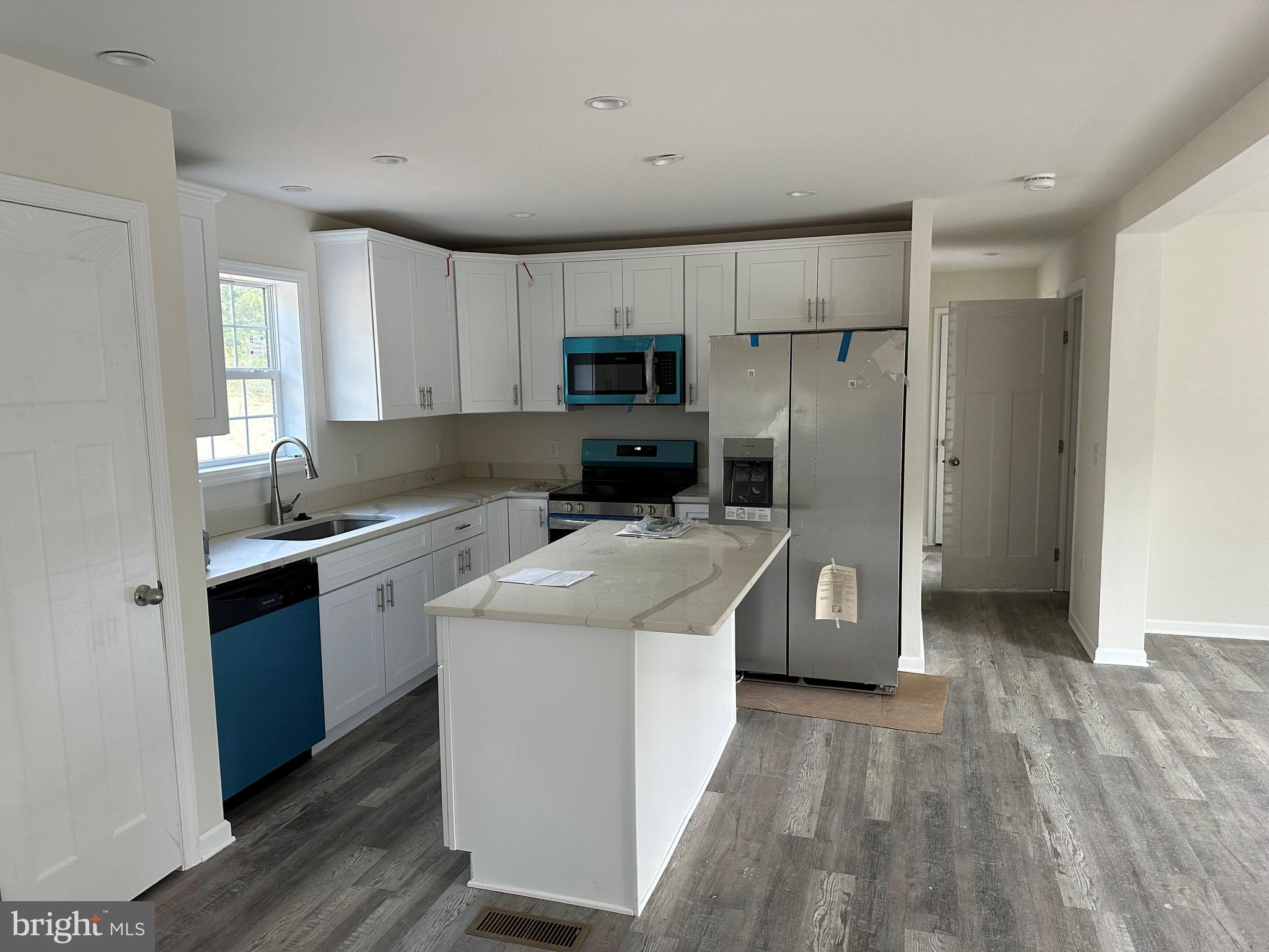 485 Toll House Road Maurertown, VA 22644 - Photo 2 of 18 a kitchen with a sink a stove and refrigerator