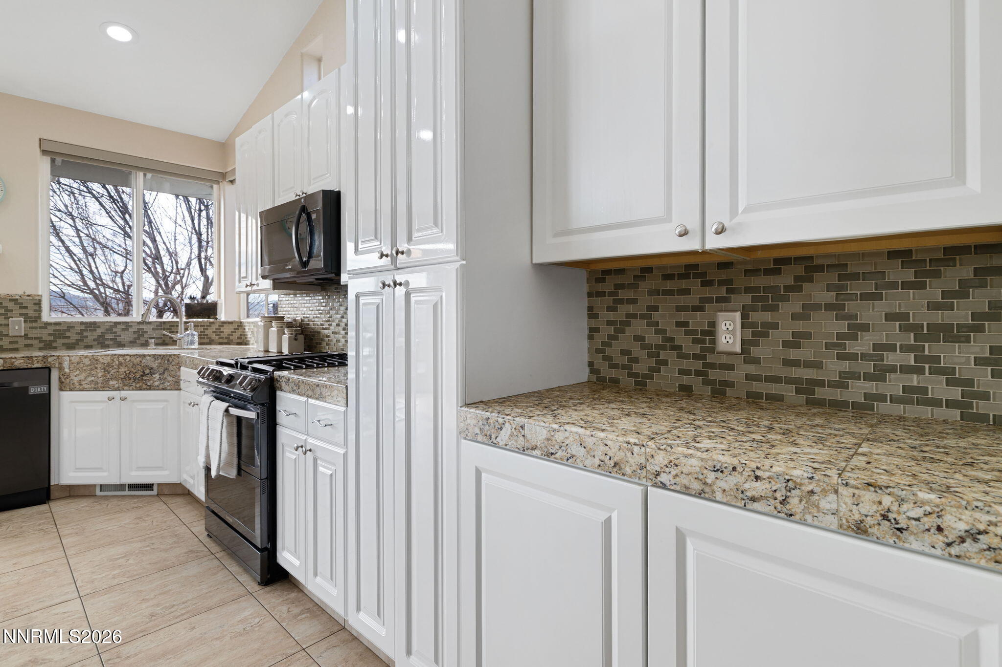 5520 High Rock Way Sparks, NV 89431 - Photo 23 of 75 a kitchen with stainless steel appliances granite countertop a sink stove and refrigerator