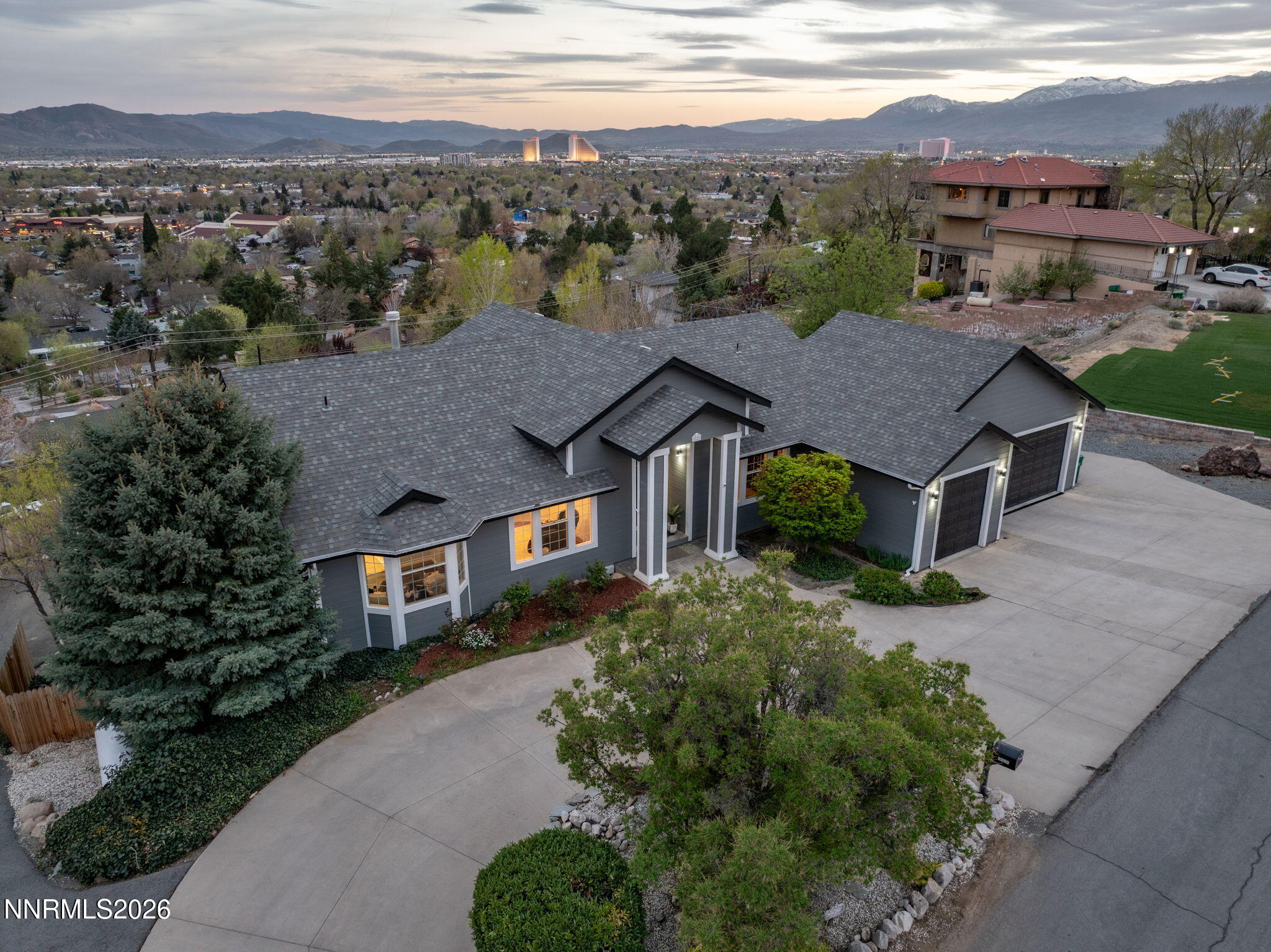 5520 High Rock Way Sparks, NV 89431 - Photo 3 of 75 an aerial view of a house with a yard and mountain view