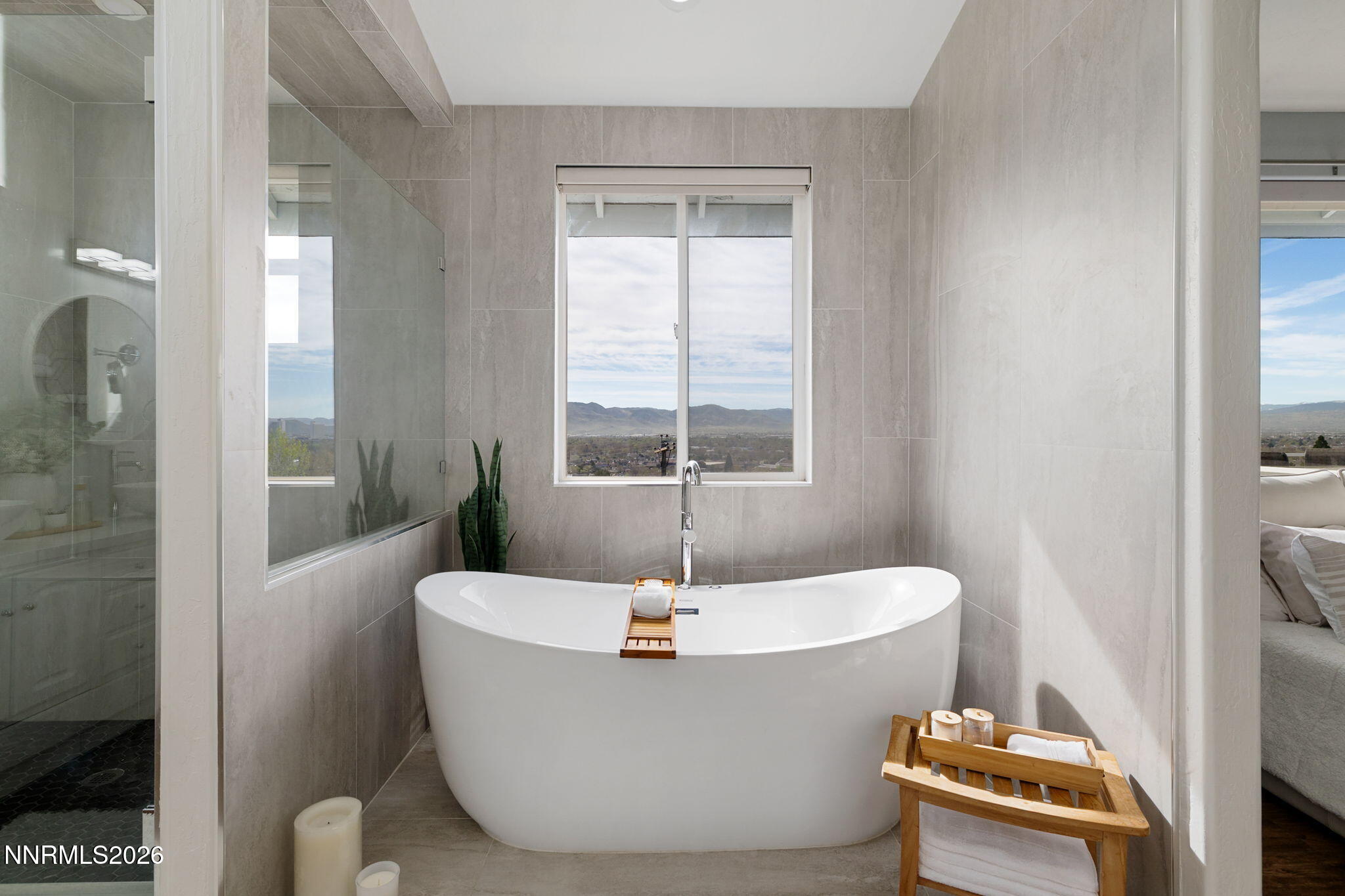 5520 High Rock Way Sparks, NV 89431 - Photo 36 of 75 a white bath tub sitting in a bathroom next to a toilet