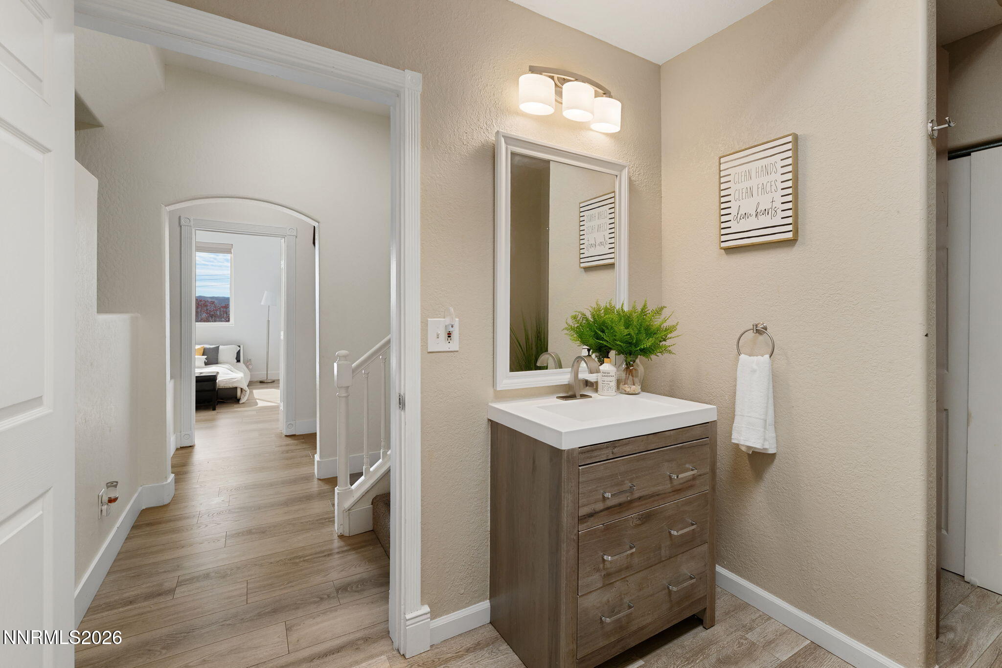 5520 High Rock Way Sparks, NV 89431 - Photo 47 of 75 a bathroom with a sink a potted plant and a mirror