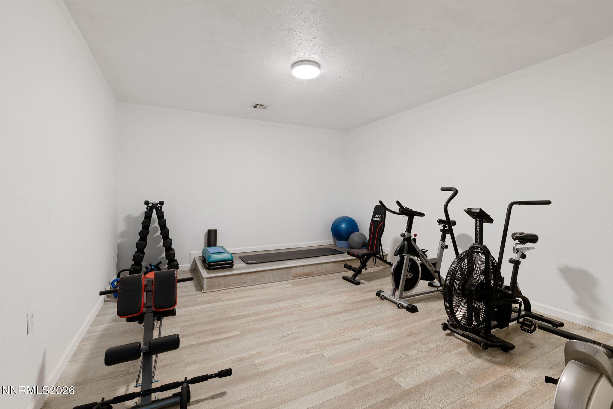 5520 High Rock Way Sparks, NV 89431 - Photo 56 of 75 a room with gym equipment and wooden floor