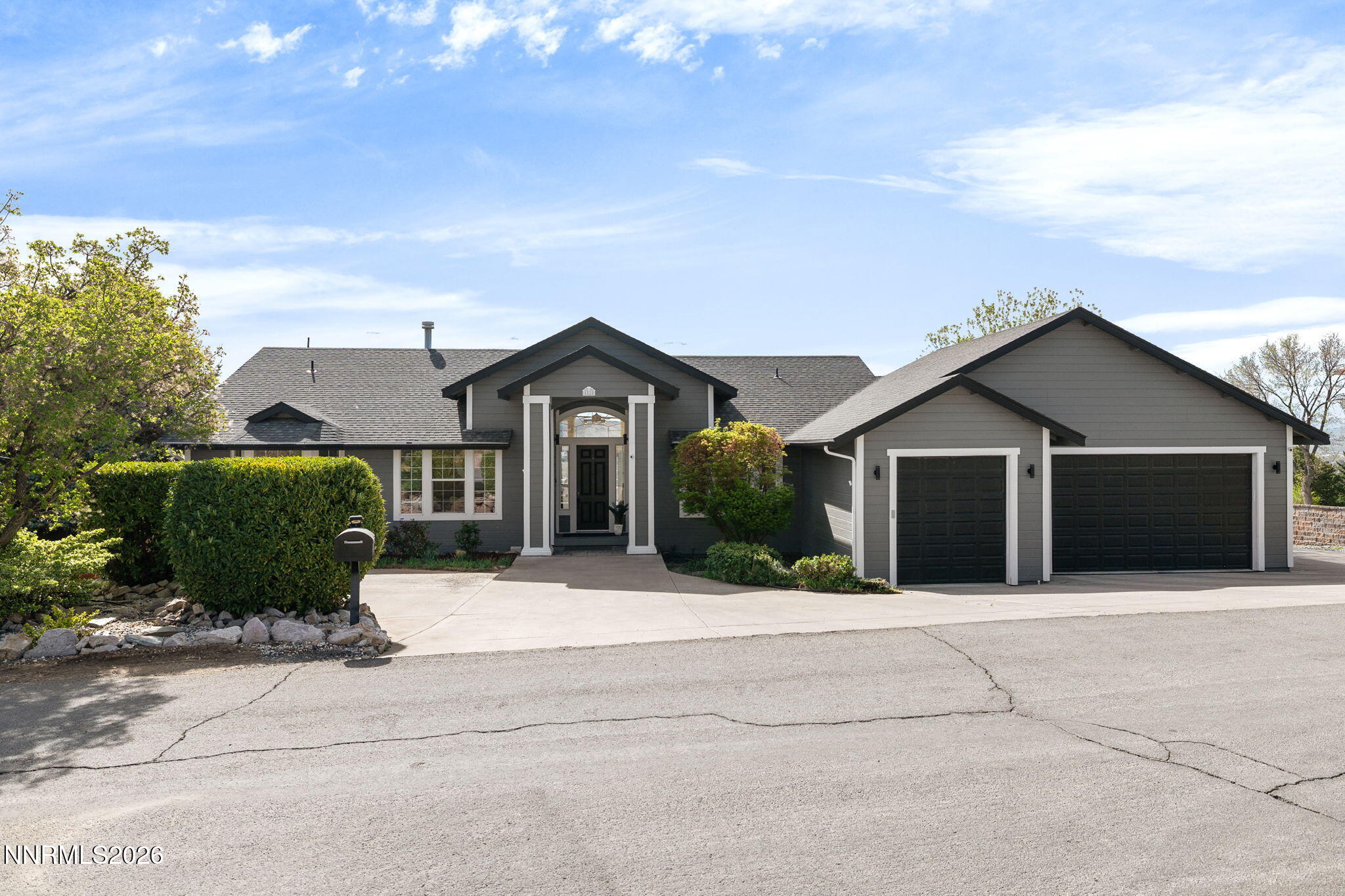5520 High Rock Way Sparks, NV 89431 - Photo 10 of 75 a front view of a house with a yard and garage
