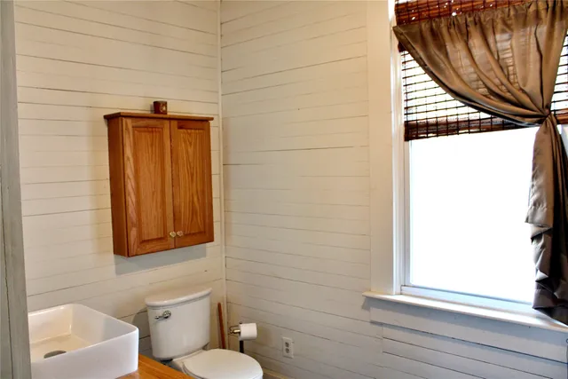 a bathroom with a bathtub and shower