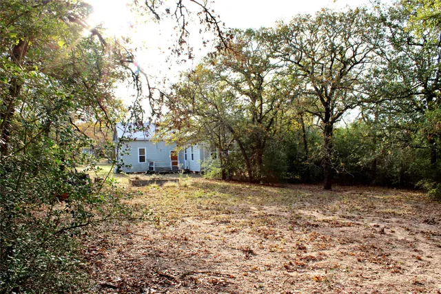 a view of swimming pool with a yard