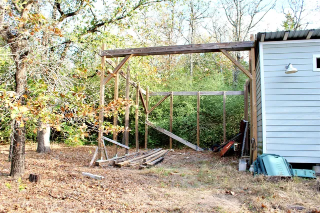 a backyard of a house with lots of green space