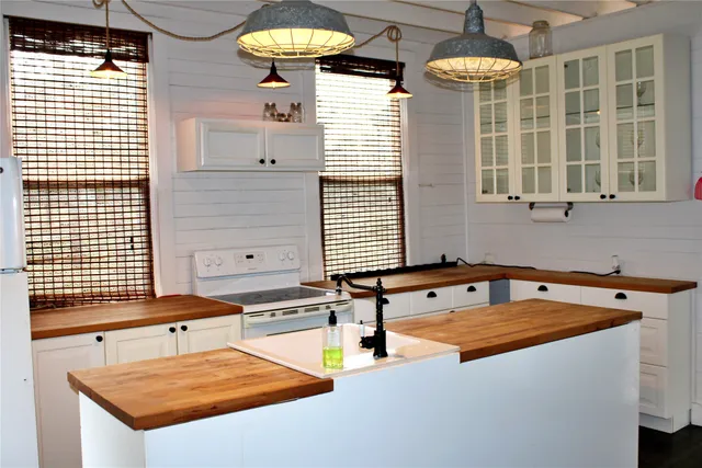 a kitchen with a sink and a stove