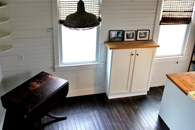 a living room with couch and a large window
