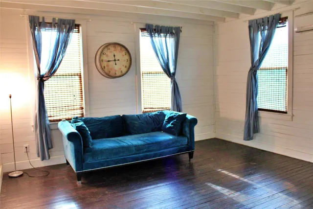 a view of entryway with wooden floor and stairs