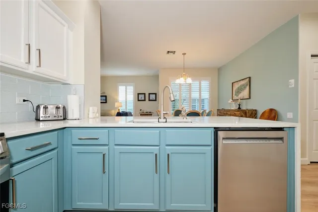 a kitchen with cabinets and white appliances
