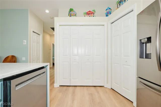 a view of a storage and utility room with a washer dryer