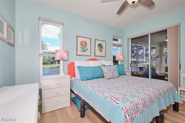 a spacious bathroom with a toilet a sink a mirror and a shower