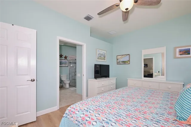 a bathroom with a toilet sink and shower