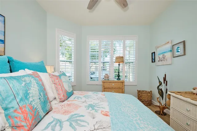 a bedroom with a bed and a large mirror