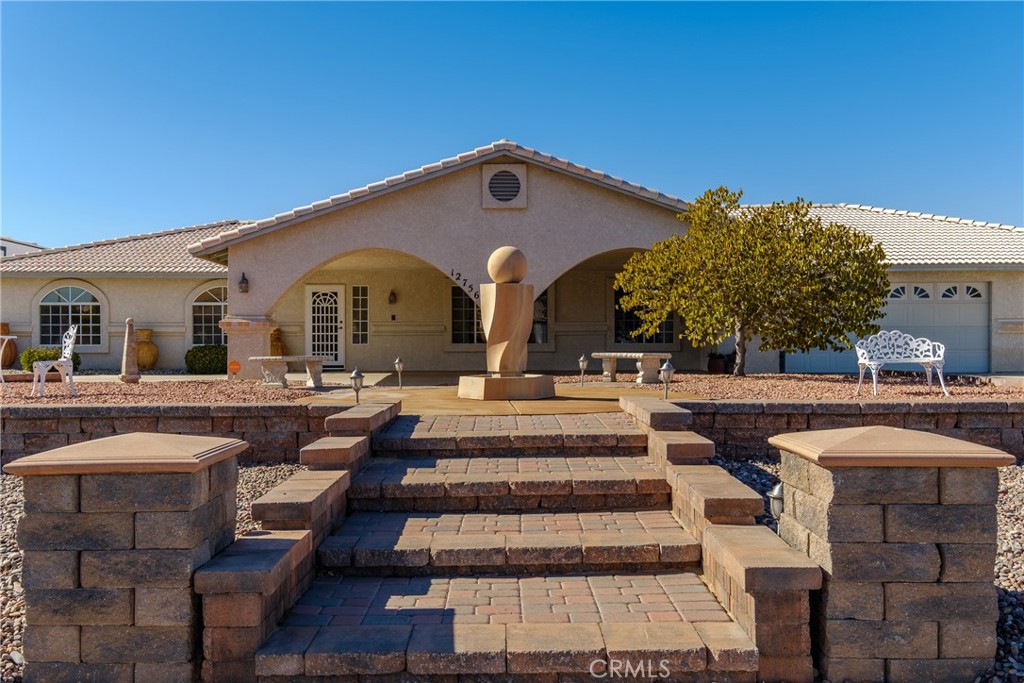 a front view of a house with swimming pool