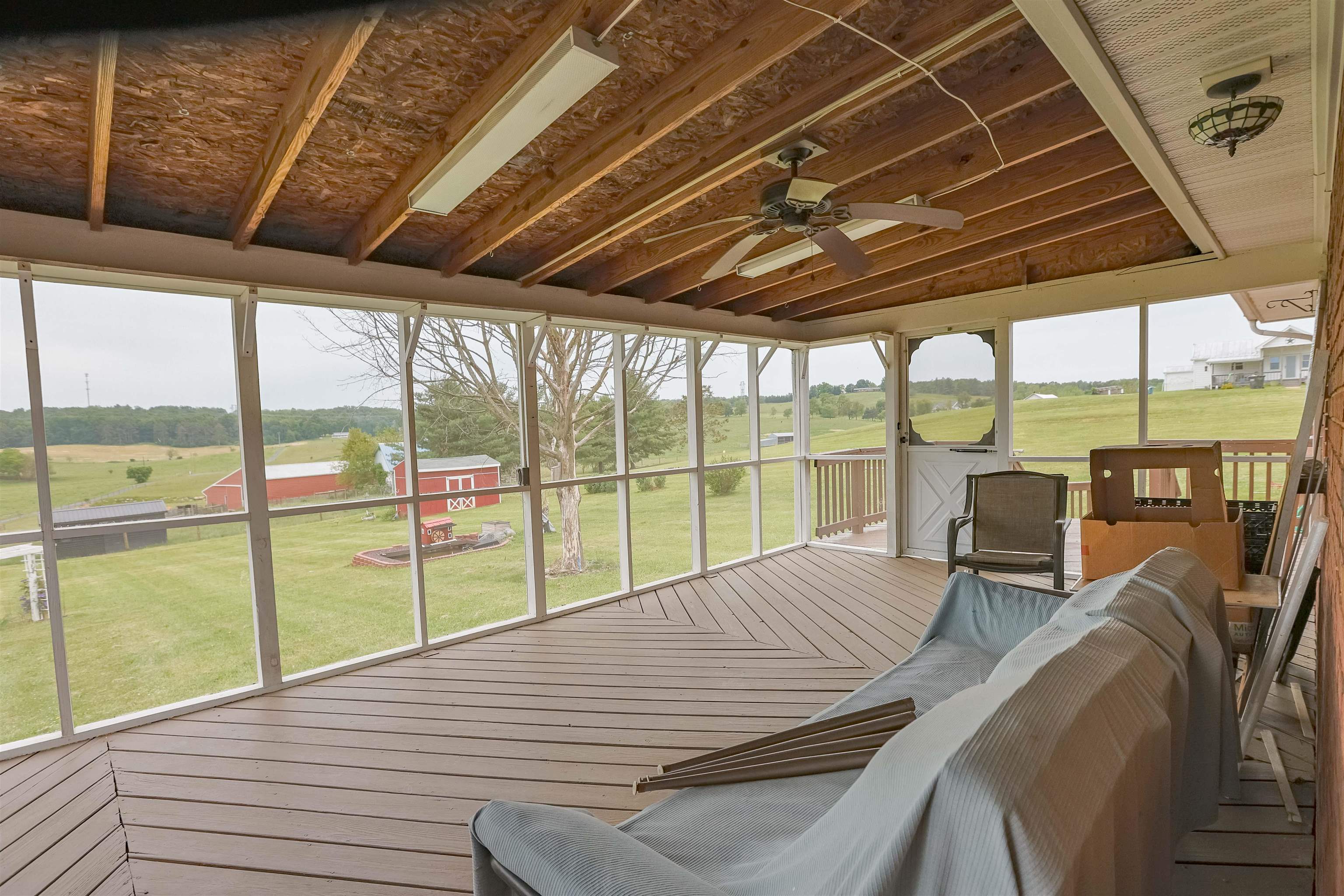 839 Kiddsville Road Waynesboro, VA 22980 - Photo 41 of 49 a view of a deck with wooden floor and outdoor seating