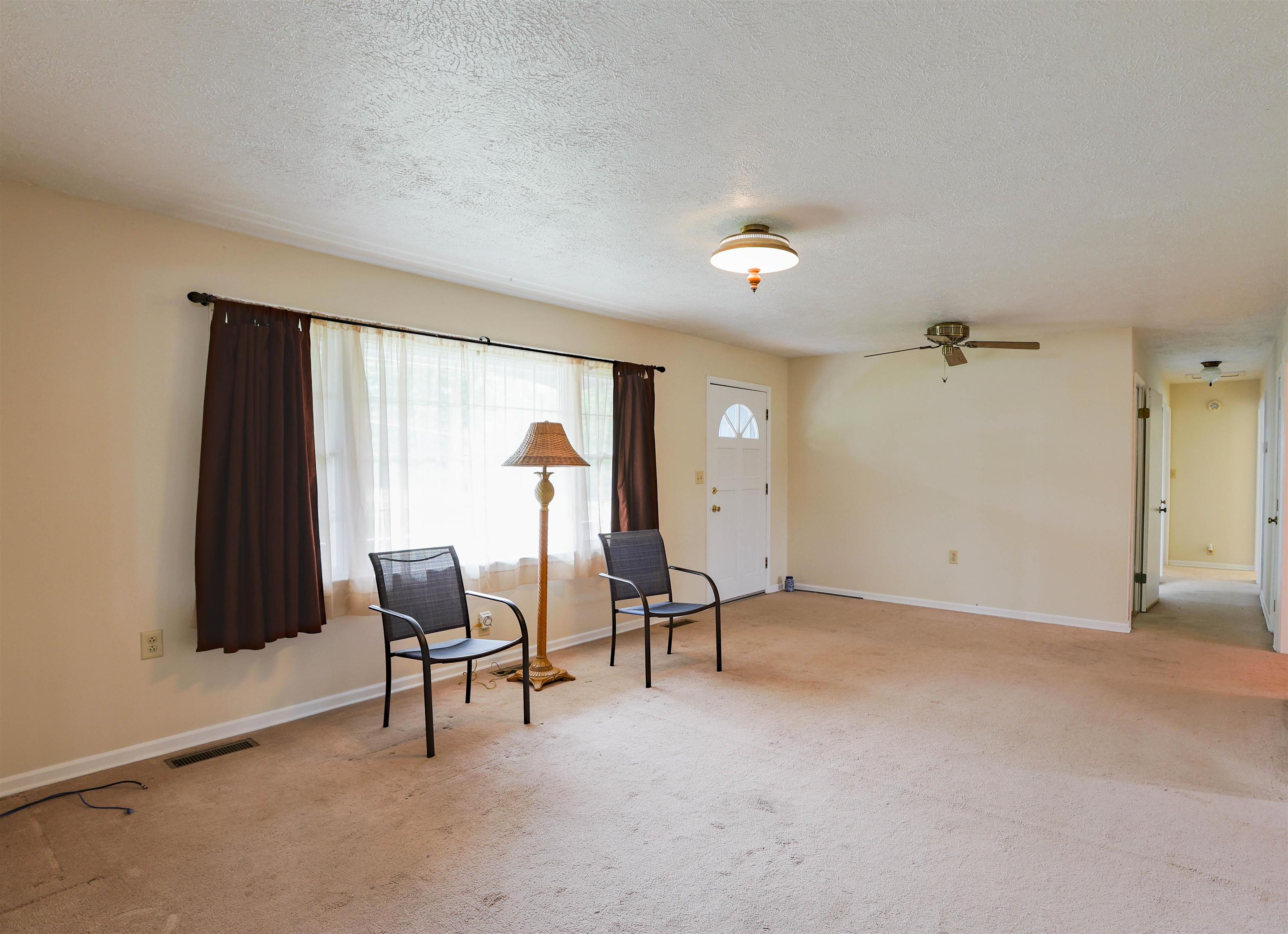 839 Kiddsville Road Waynesboro, VA 22980 - Photo 8 of 49 an empty room with furniture and a window