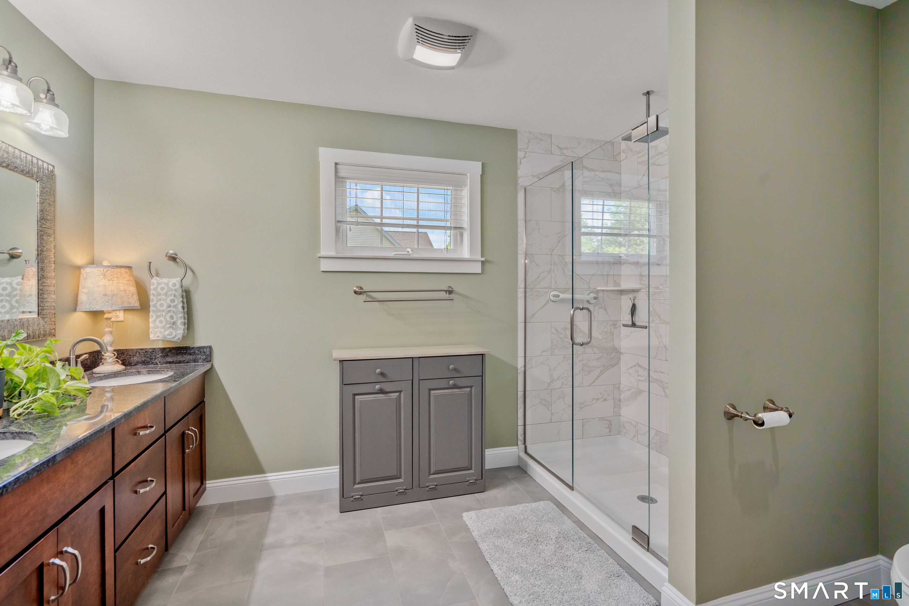 5 Limric Lane Suffield, CT 06078 - Photo 22 of 36 a spacious bathroom with a granite countertop sink a mirror and a shower