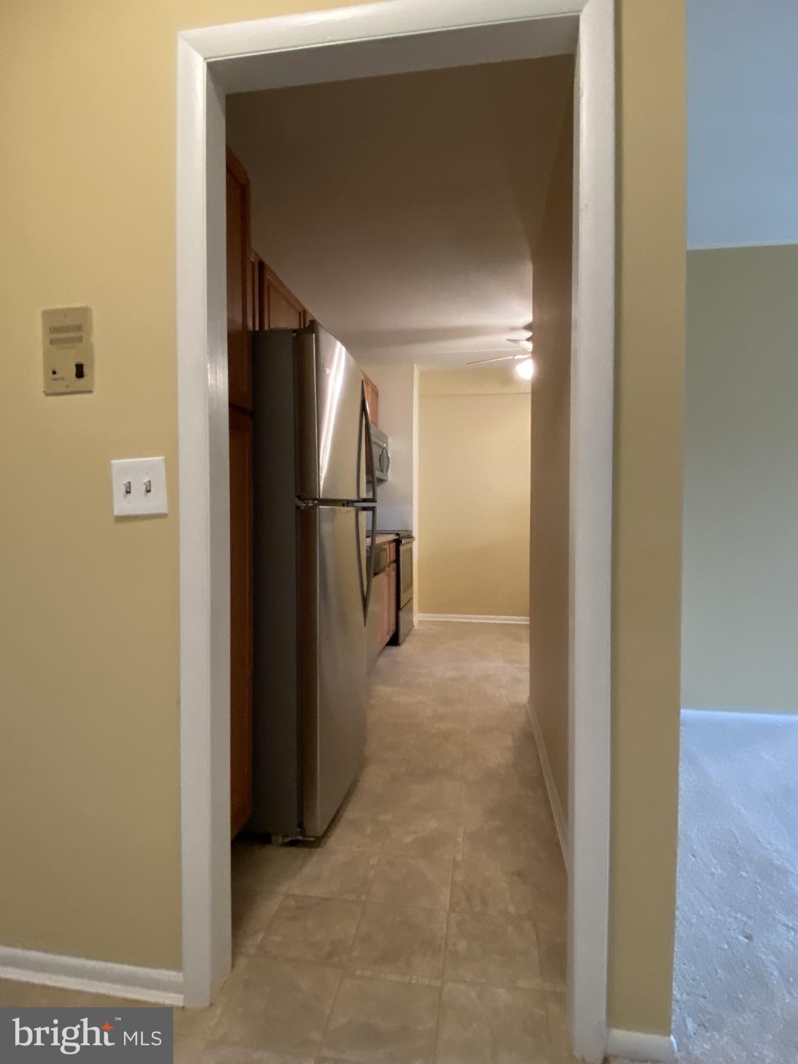 68 Welsh Tract Road, Unit 210 Newark, DE 19713 - Photo 5 of 12 To Galley Kitchen w/ SS Appliances