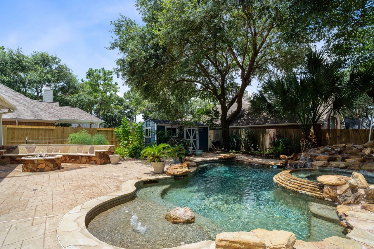 20406 Ranger Point Court Katy, TX 77450 - Photo 1 of 50 Welcome home to Paradise. Pool, Spa, Sunbath area, Firepit, Living Garden of fruits and Vegetables and more!