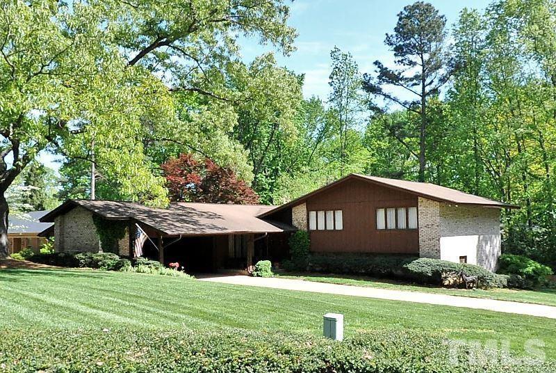 3413 Malibu Drive Raleigh, NC 27607 - Photo 1 of 30 a front view of a house with garden
